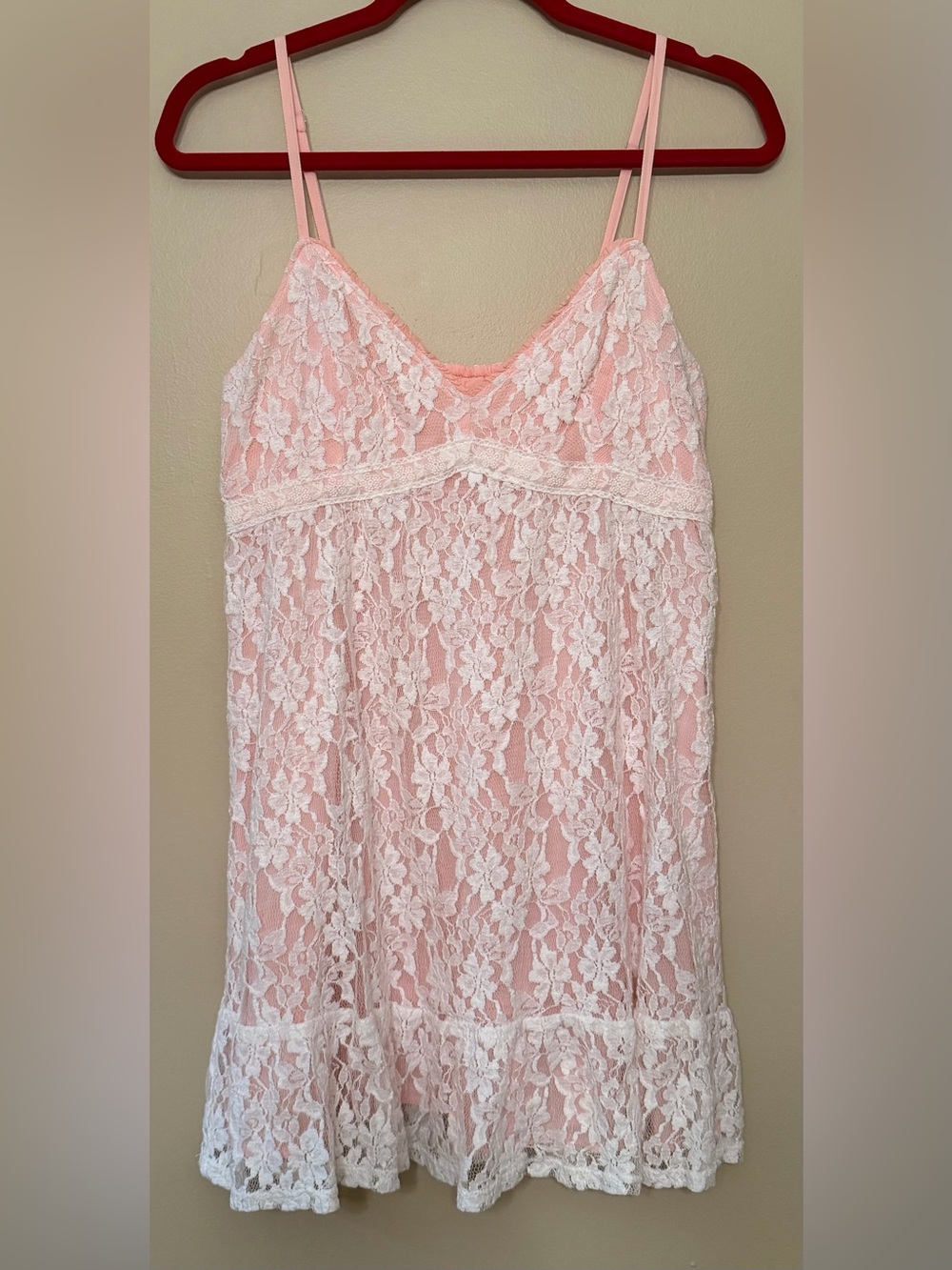 Hollister Co. babydoll mini dress featuring pink material covered in white lace